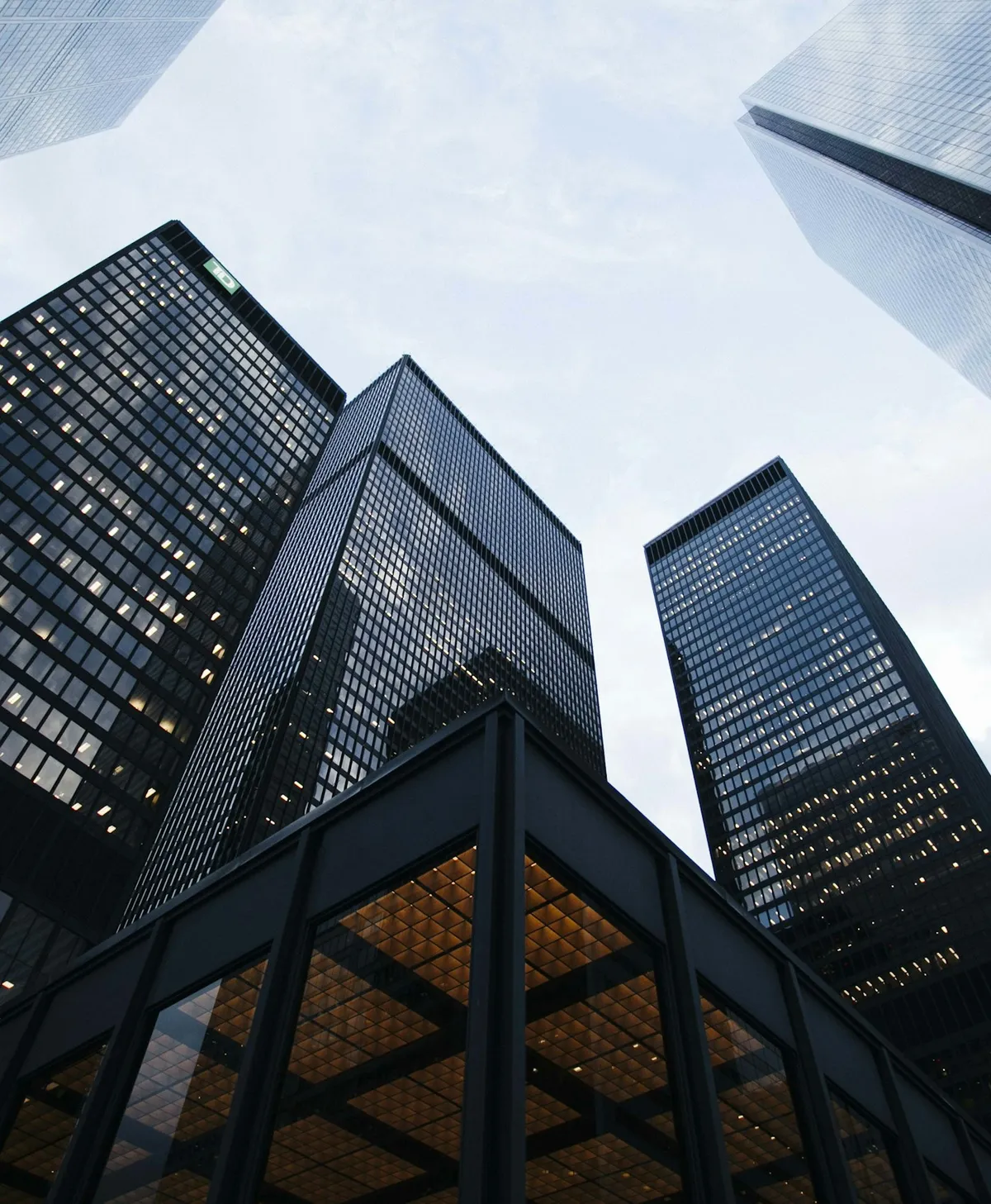 A modern high-rise residential building viewed from below